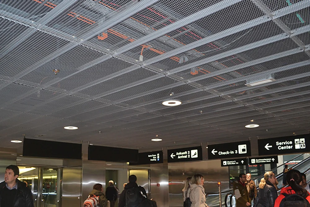 Application scenarios of mesh aluminum panels in airport ceilings.