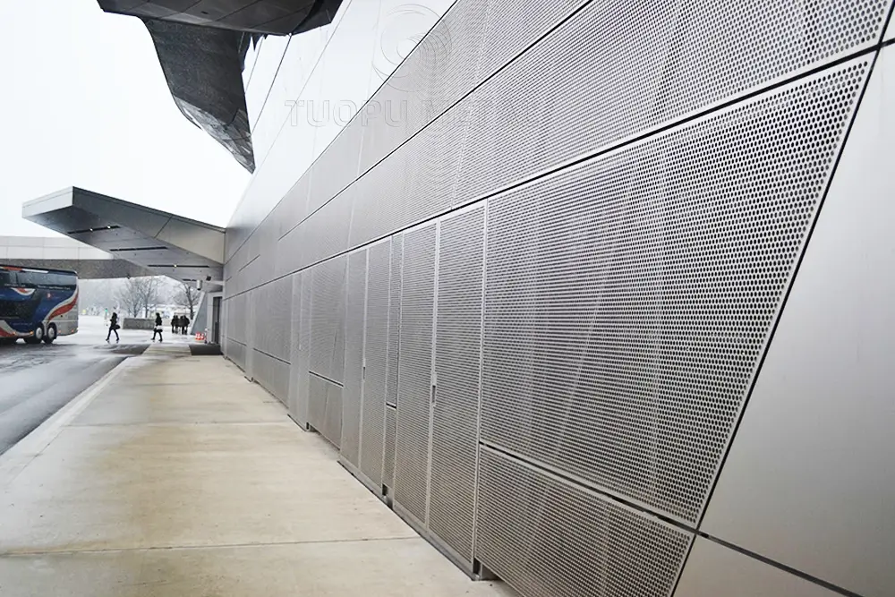 Application of perforated aluminum panels in outdoor curtain walls.
