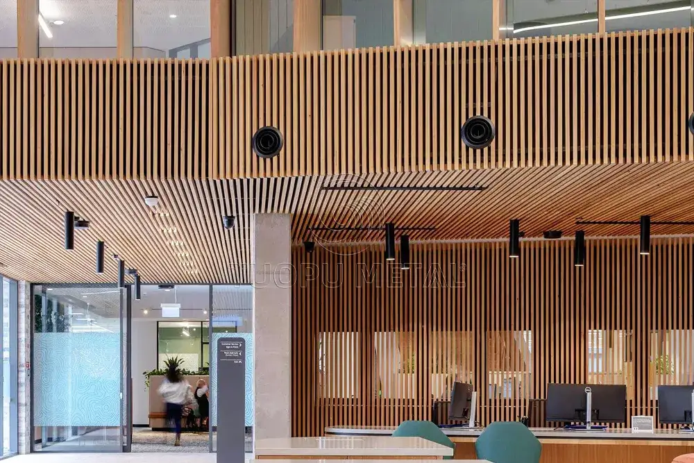 A commercial building's interior office area uses a timber ceiling batten.