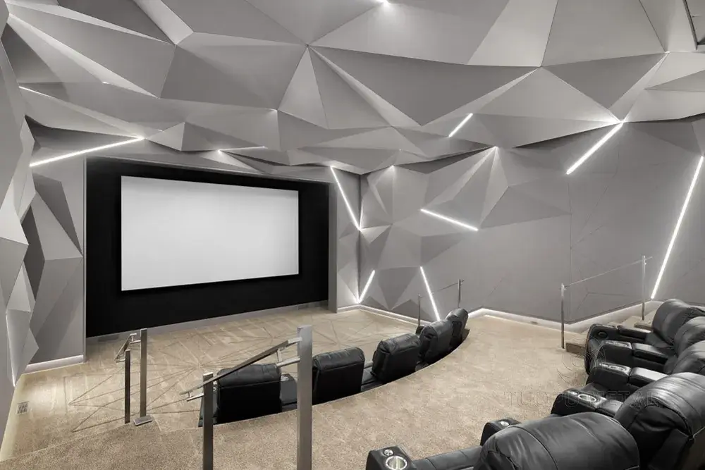 Home theater with 3D geometric aluminum wall panels and integrated LED lighting.