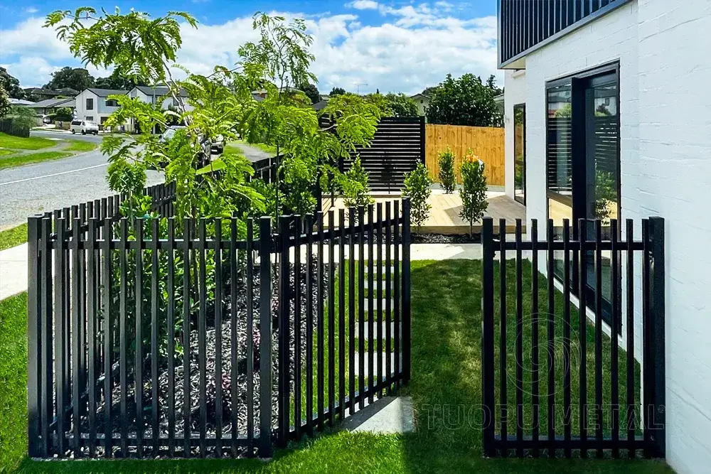 Demonstration of tubular aluminum fences used in residential gardens